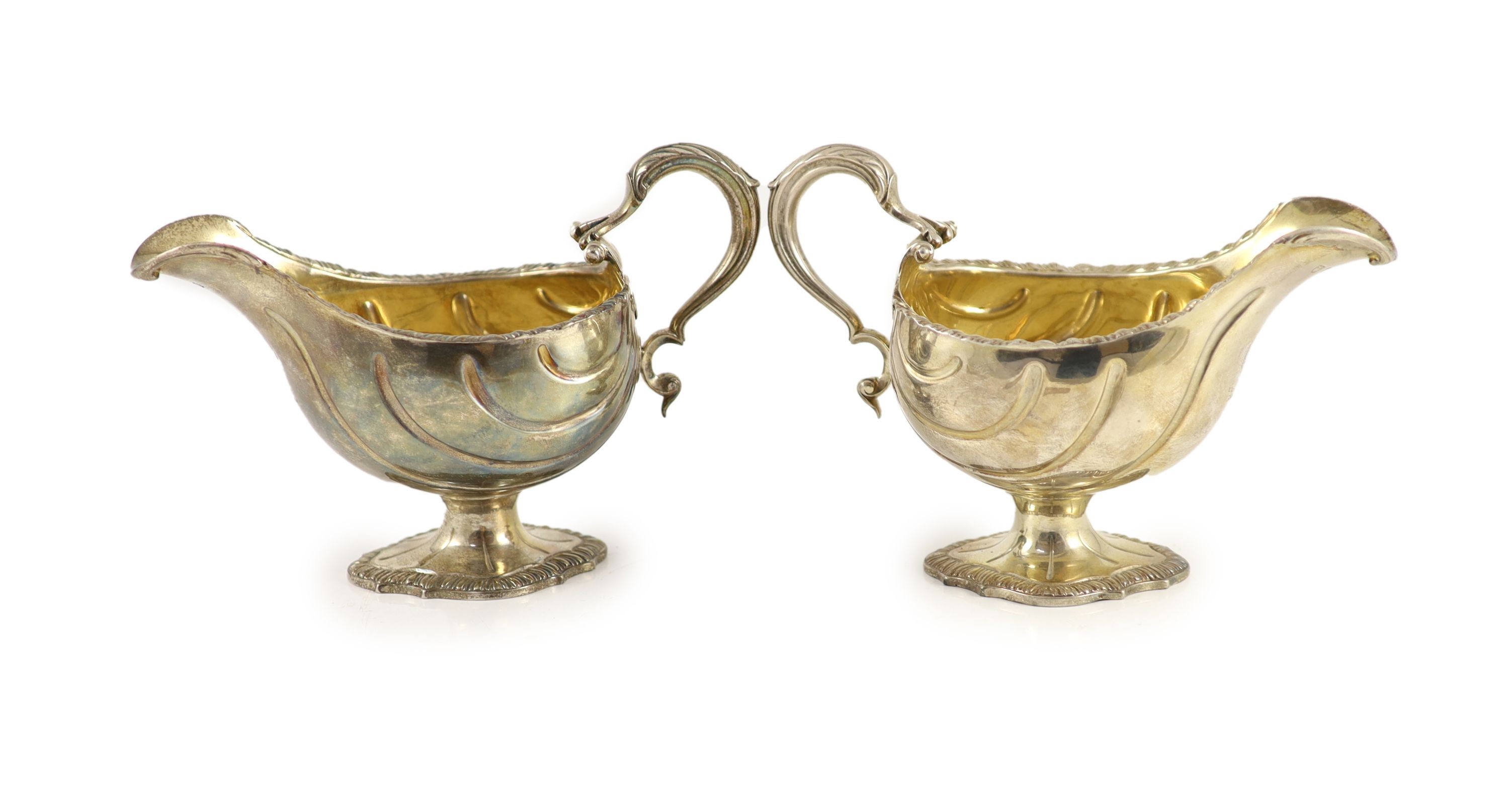 A pair of early George III silver oval pedestal sauce boats by Whyte & Holmes?